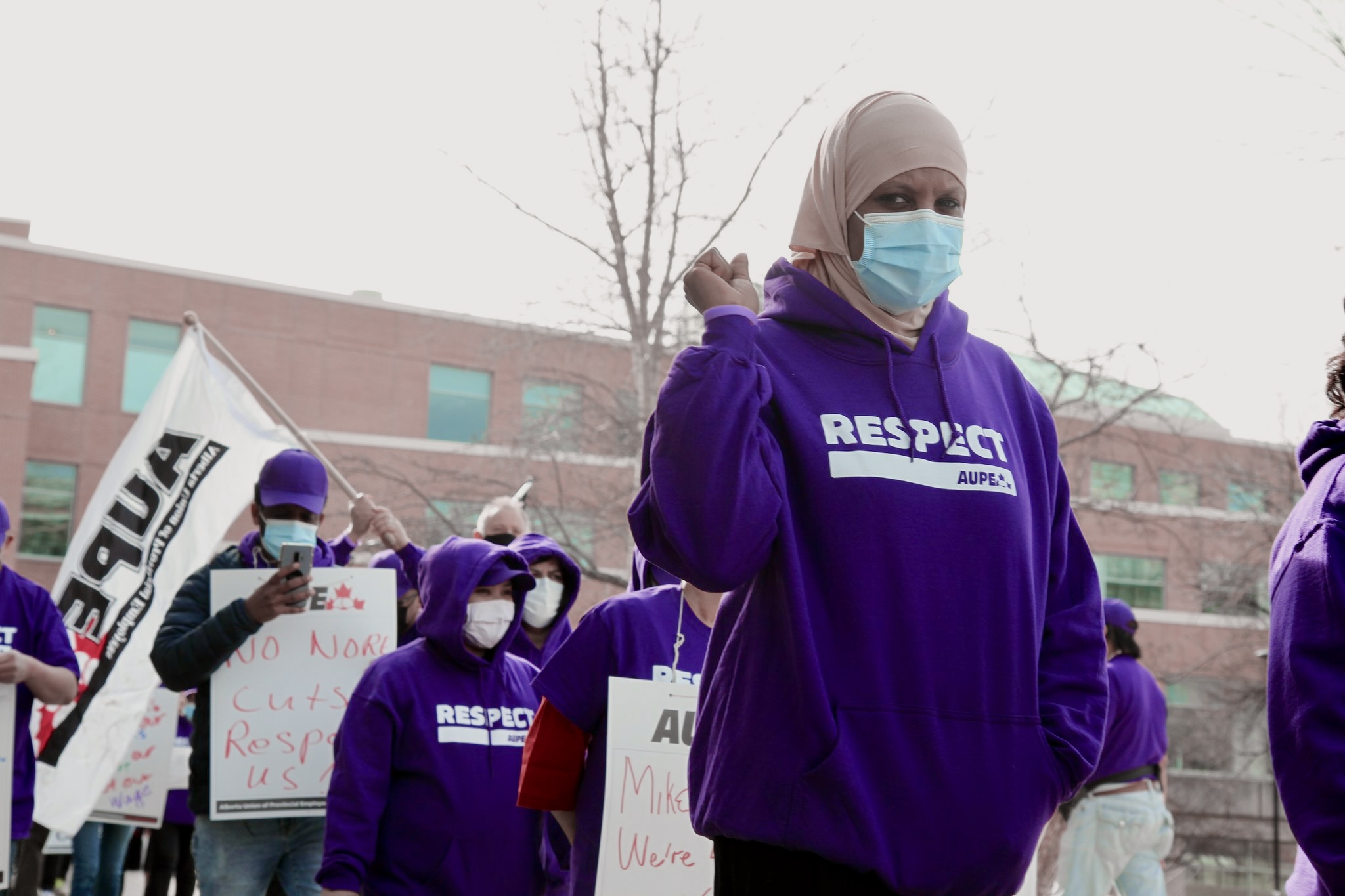 AUPE members working for the University of Calgary march for respect and fair wages.