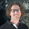 A headshot of Peter Cole, who is looking into the camera and smiling.