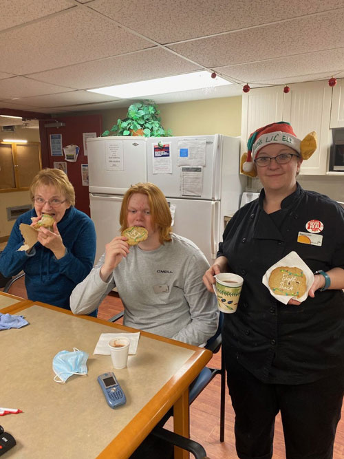 Revera Aspen Ridge members pose with their Christmas cookies